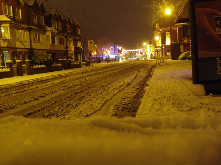 Lindon road covered in snow at night